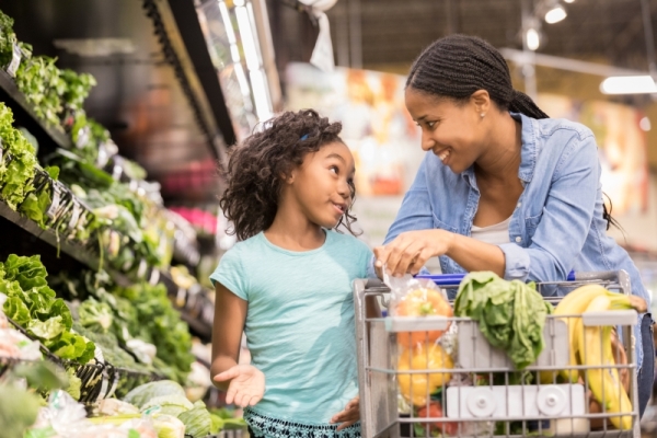 mother and daughter in the grocery store 